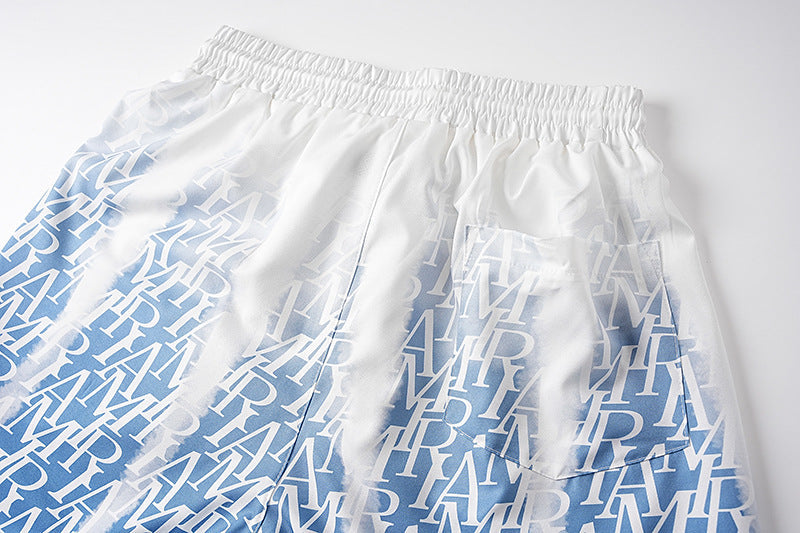 AMRI logo-print gradient silk shorts